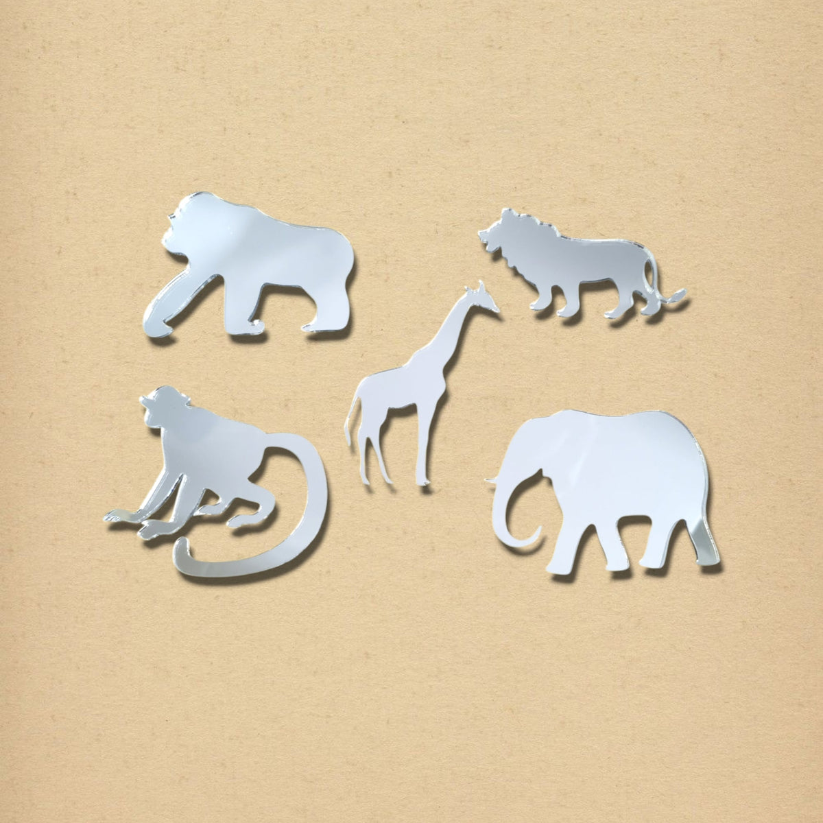 A bundle of five silver reflective safari animal mirrors including a gorilla, lion, giraffe, monkey, and elephant.