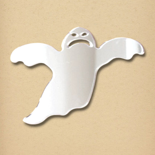 Spooky ghost-shaped mirror in reflective silver with cut-out eyes and mouth on a tan background.