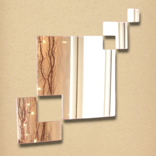 A wall mirror composed of four connected square glass pieces of varying sizes on a beige background.