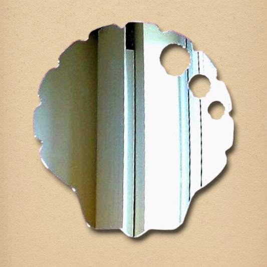 Irregular, scalloped-edge silver mirror with three circular cutouts, displaying a room reflection.