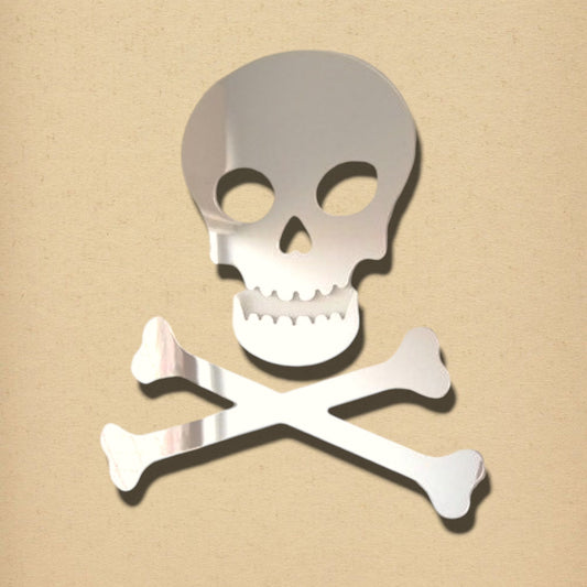 Silver skull and crossbones shaped mirror against a textured beige background.