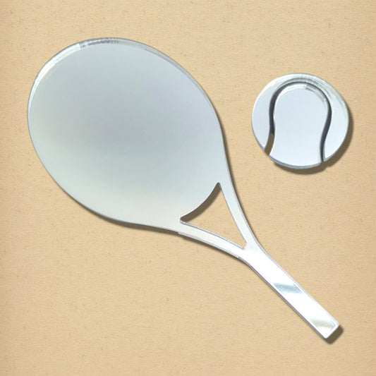 Tennis racket and tennis ball-shaped silver mirrors on a neutral background.