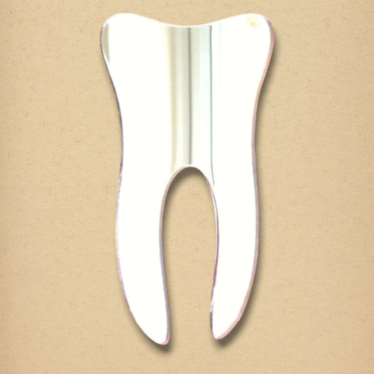 Tooth-shaped reflective mirror on a neutral tan background.