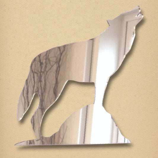 A silver mirror shaped like a howling wolf on a rock.