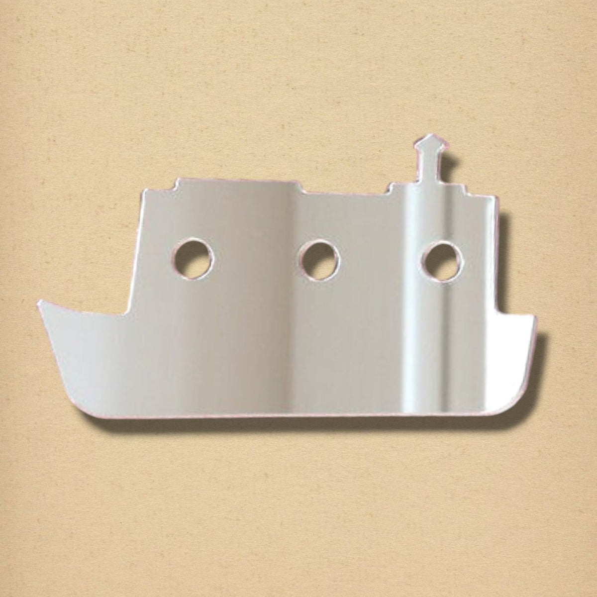 Tug boat-shaped mirror with three circular portholes and a smokestack.