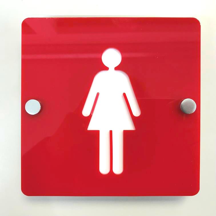 Square red female toilet sign with a white woman figure, mounted with silver standoffs.
