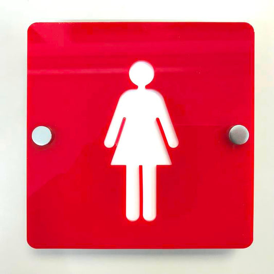 Square red female toilet sign with a white woman figure, mounted with silver standoffs.