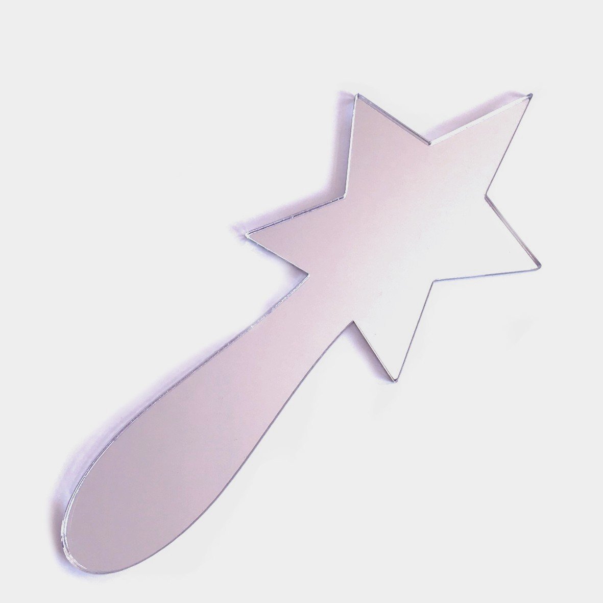 Star-shaped hand held mirror with a rounded handle, isolated on a white background.