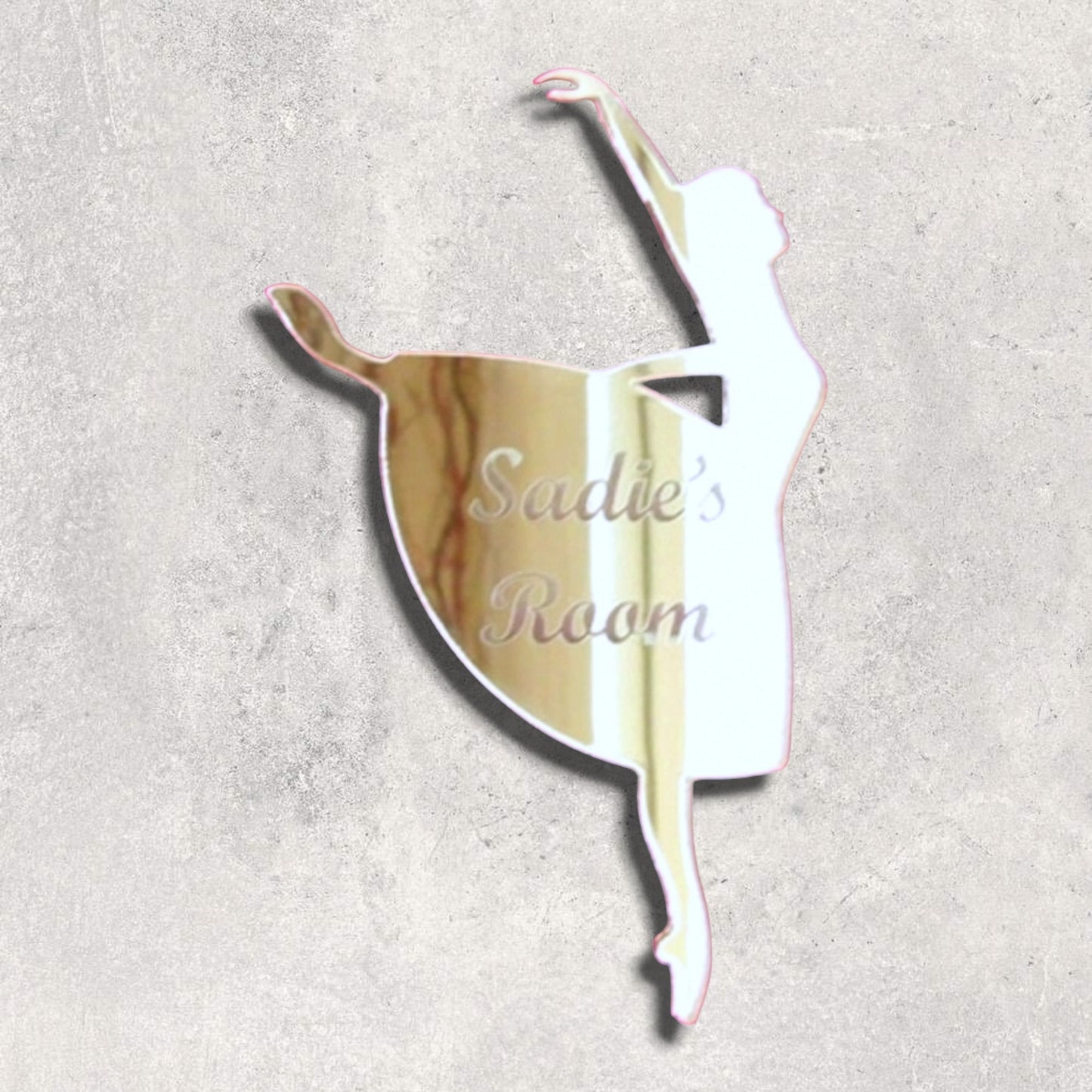 Personalised pink-rimmed mirror in the shape of a dancing ballerina, etched with the text "Sadie's Room".