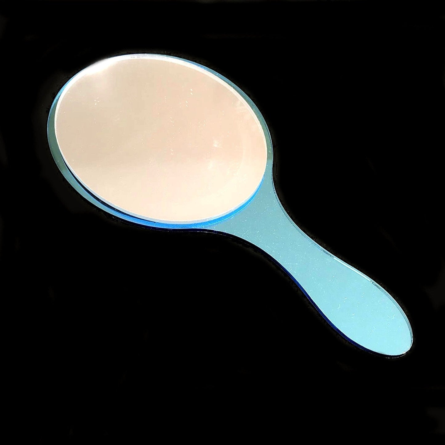 An oval hand-held mirror with a light blue plastic frame and handle.
