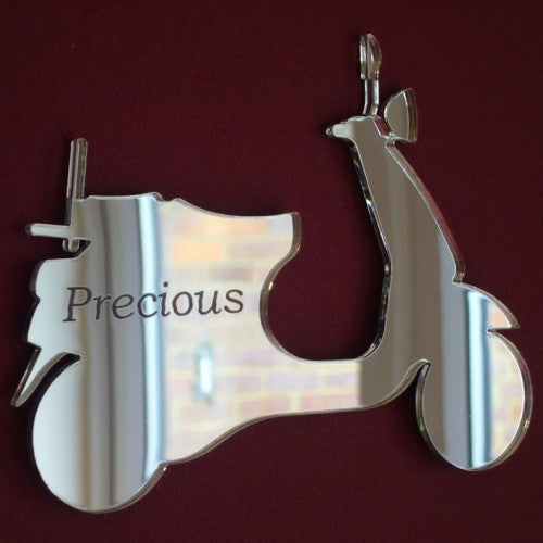 Silver moped scooter-shaped mirror with the word "Precious" etched on the side.