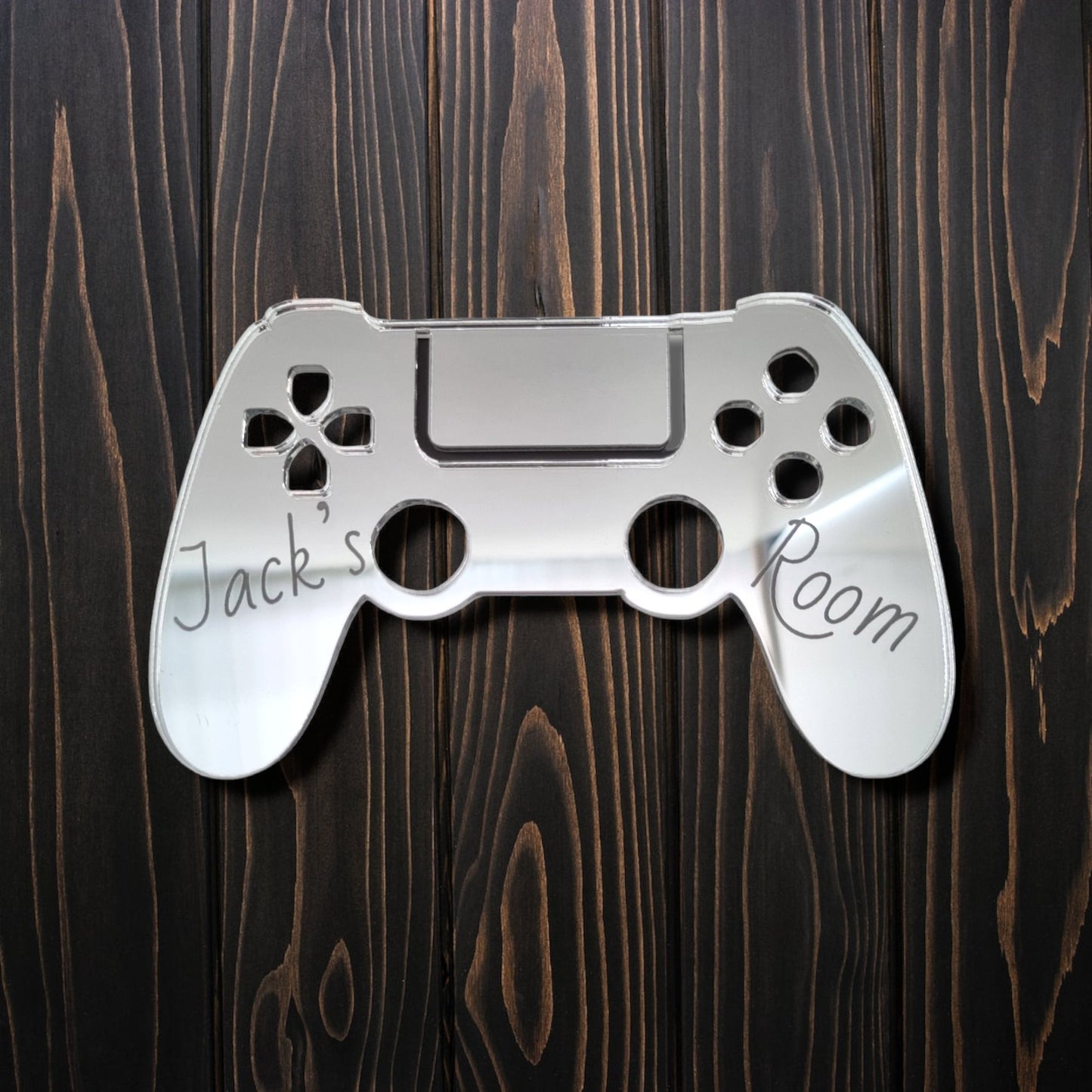 Personalised controller-shaped mirrored door sign with engraved text "Jack's Room".