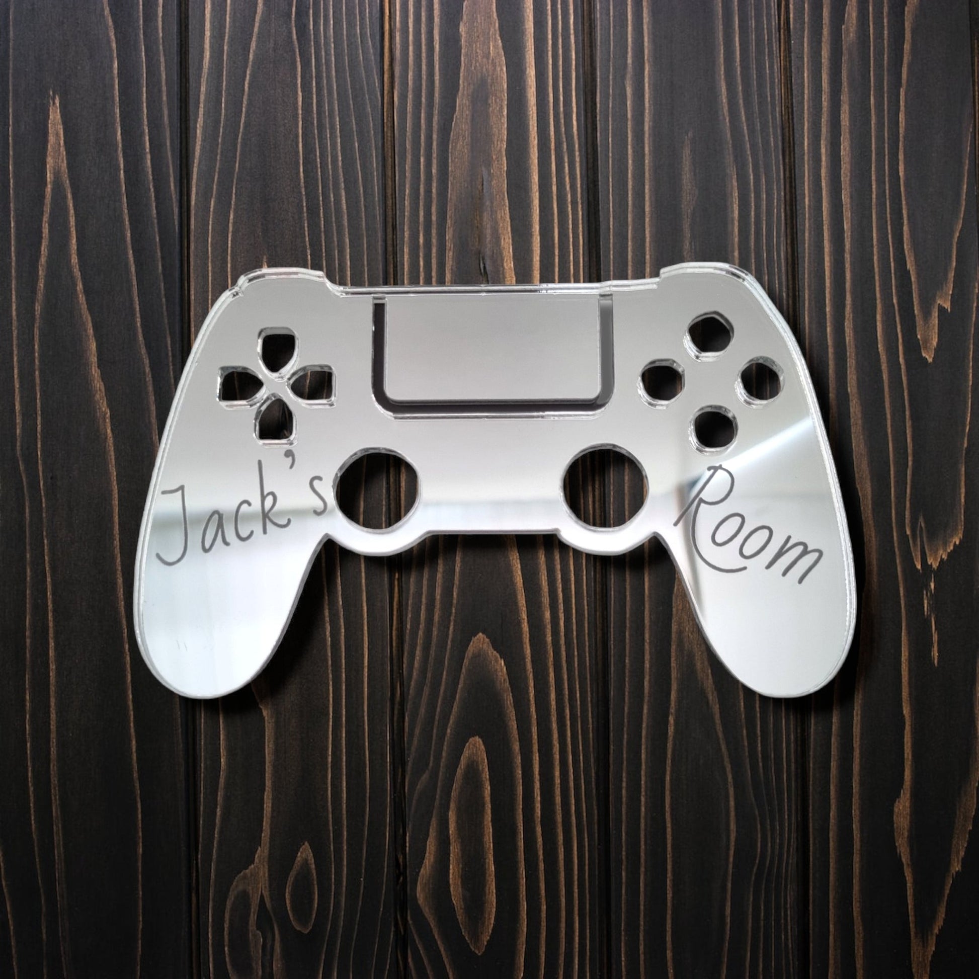 Personalised controller-shaped mirrored door sign with engraved text "Jack's Room".