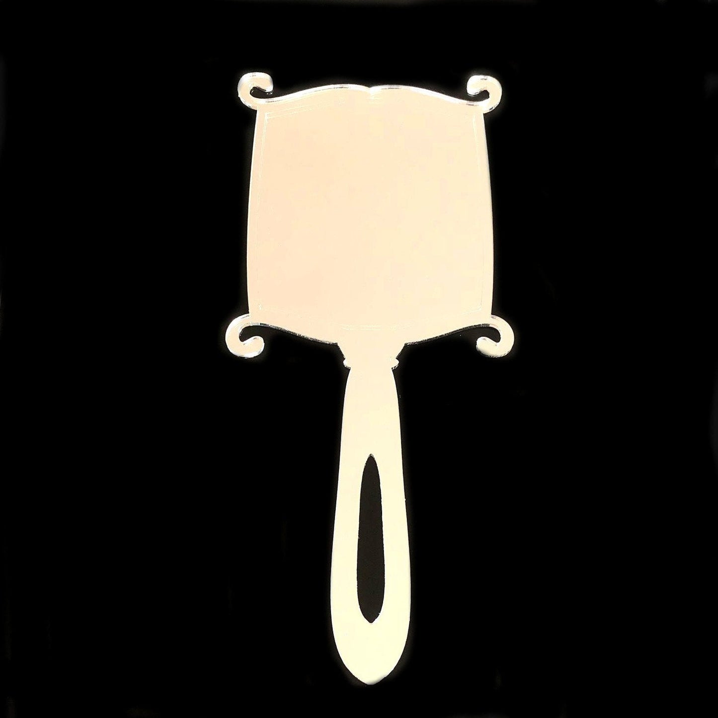 Art Deco rectangular hand-held mirror with curved corners, scroll accents, and a handle with a cutout.