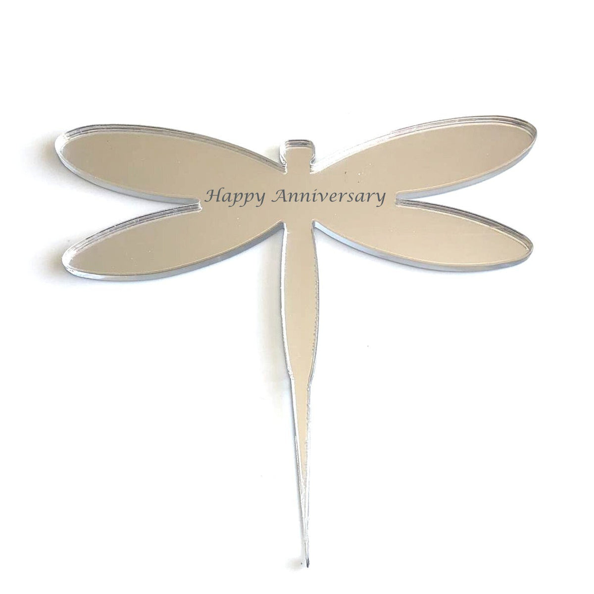 Silver, mirrored dragonfly cake topper engraved with "Happy Anniversary" in elegant script.