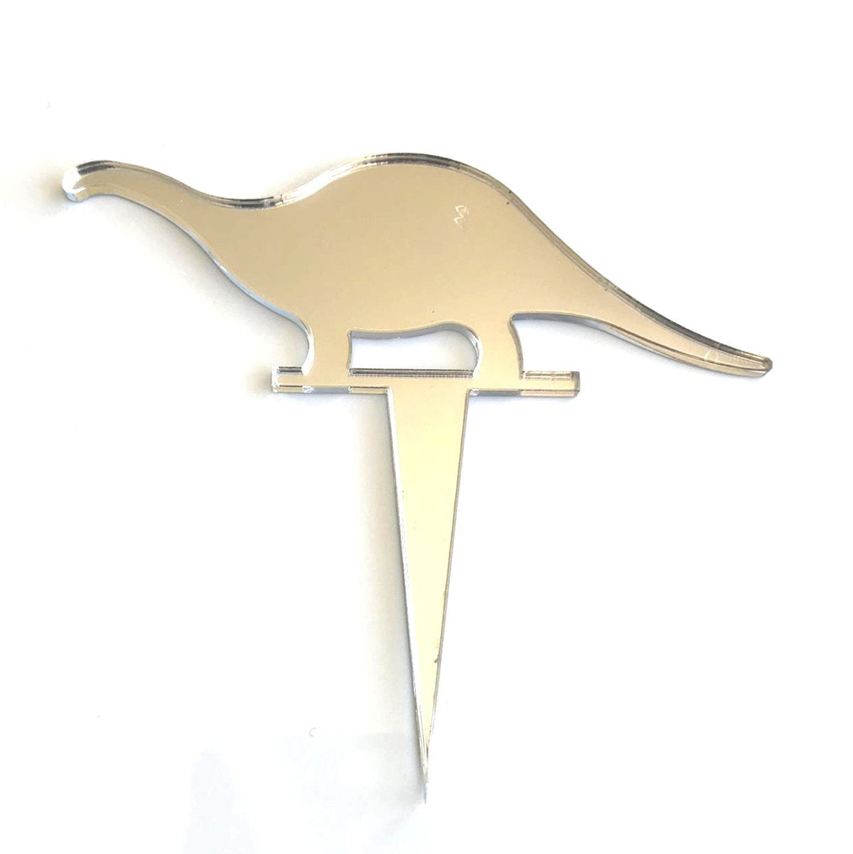 A shiny, mirrored silver Brontosaurus-shaped cake topper made from recycled acrylic with a pointed base.
