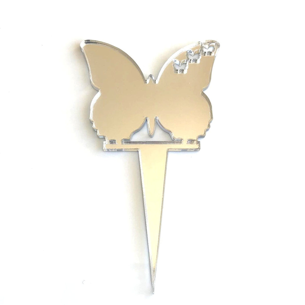 Reflective silver acrylic butterfly cake topper with three small butterfly cutouts on the right wing.