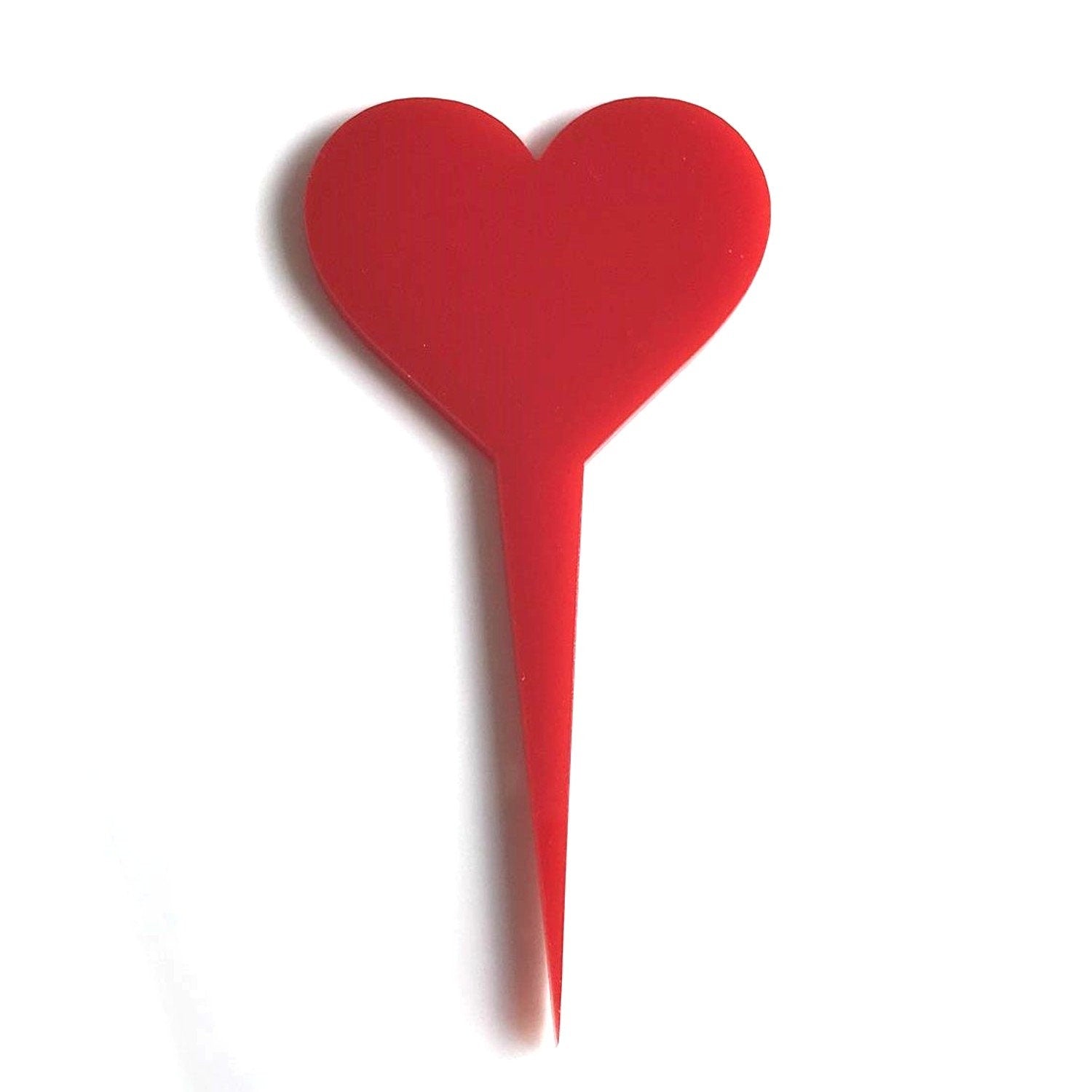 Red acrylic playing card heart suit cake topper on a white background.