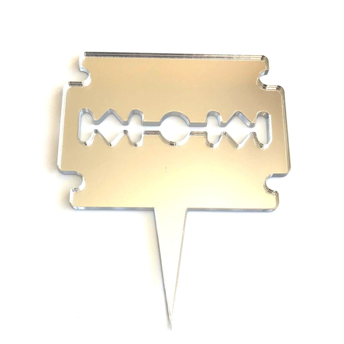 Silver mirror-finish acrylic razor blade cake topper with a sharp spike at the bottom.