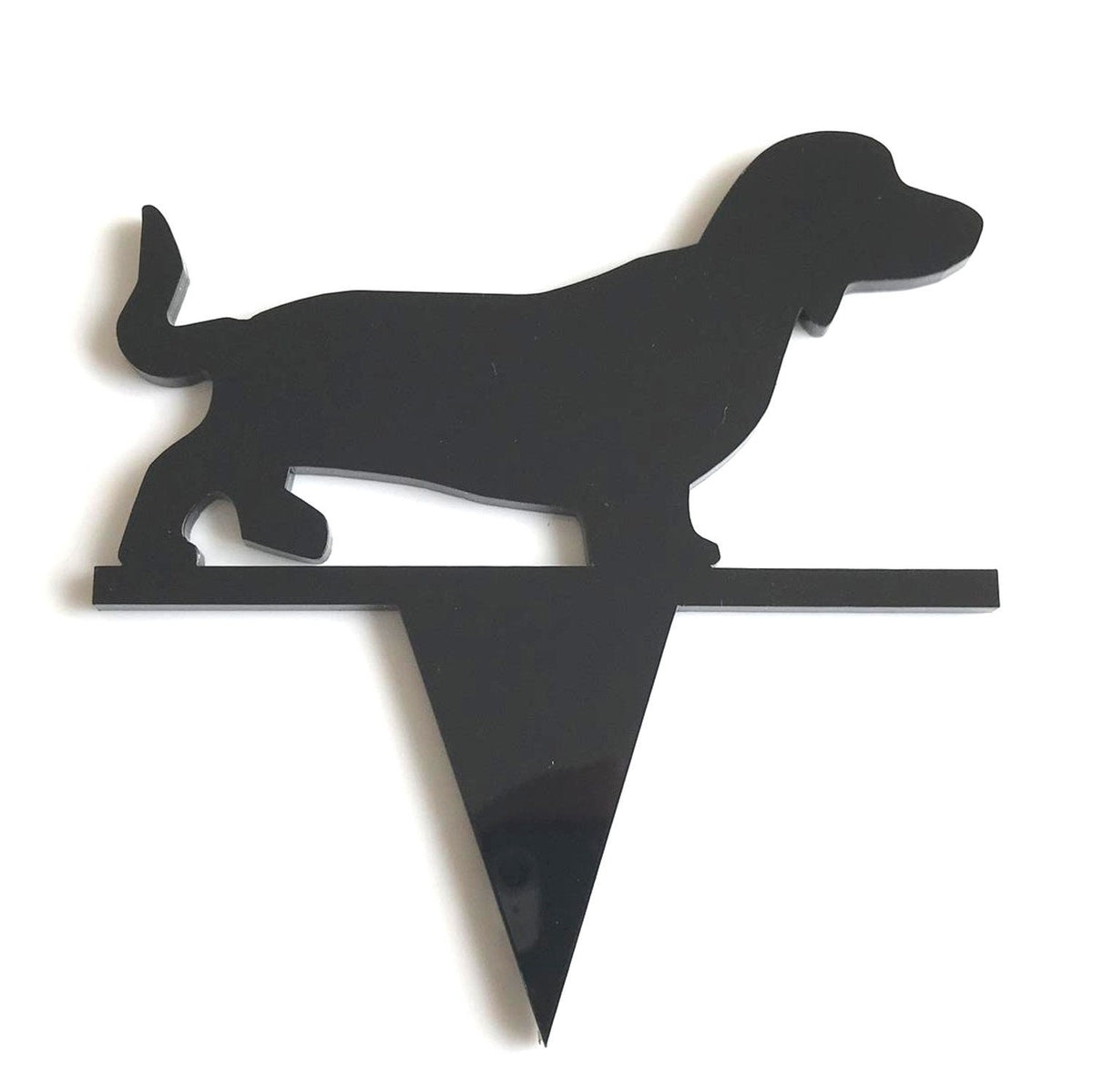Black acrylic dachshund silhouette cake topper with a triangular stake, set against a plain white background.