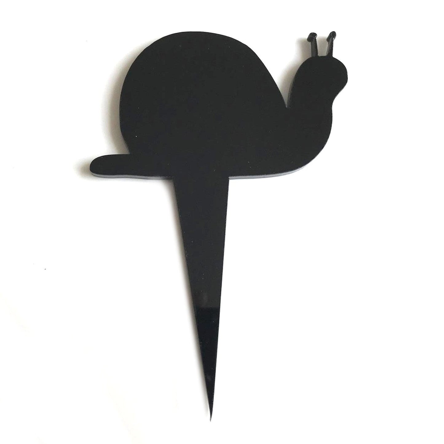 Minimalist black snail-shaped recycled acrylic cake topper on a pointed stake against a white background.