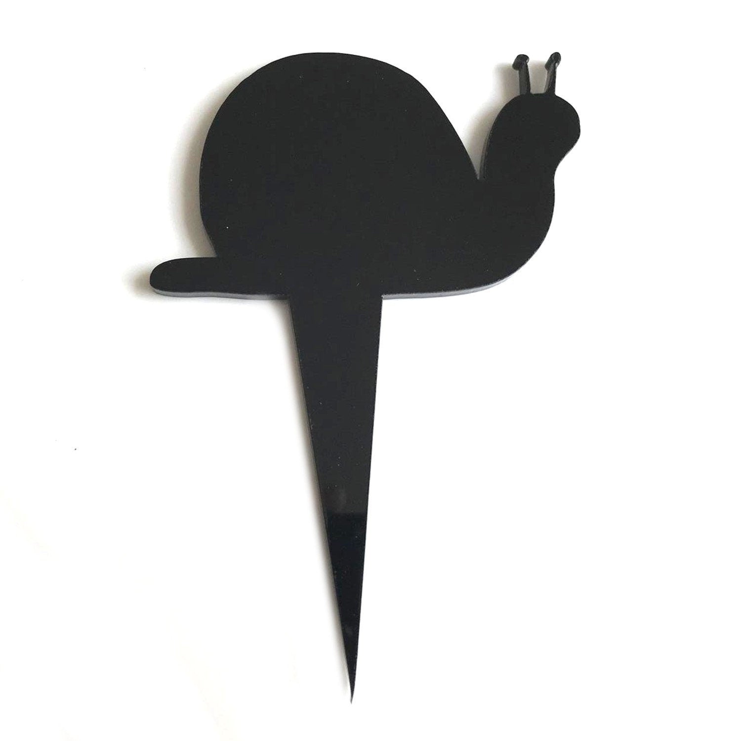Minimalist black snail-shaped recycled acrylic cake topper on a pointed stake against a white background.