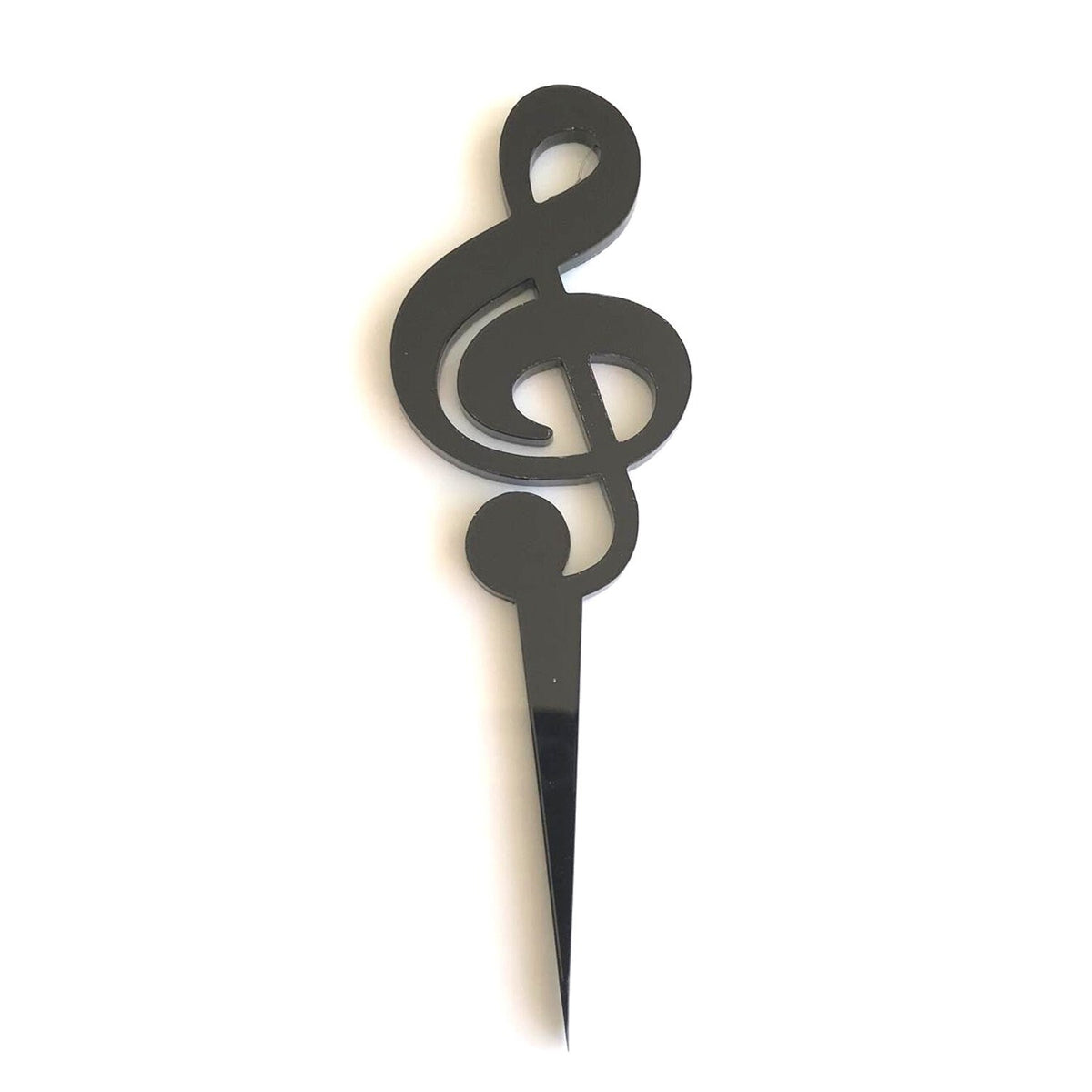 Black acrylic treble clef cake topper with a sharp, pointed stake for insertion into a cake.