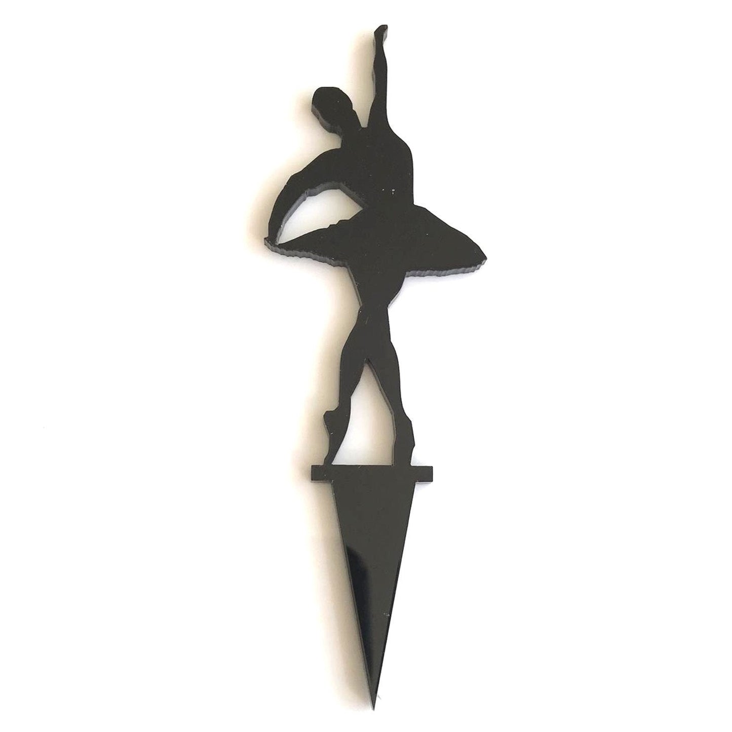 Black acrylic cake topper featuring a silhouette of a ballerina in a dance pose on a pointed stake.