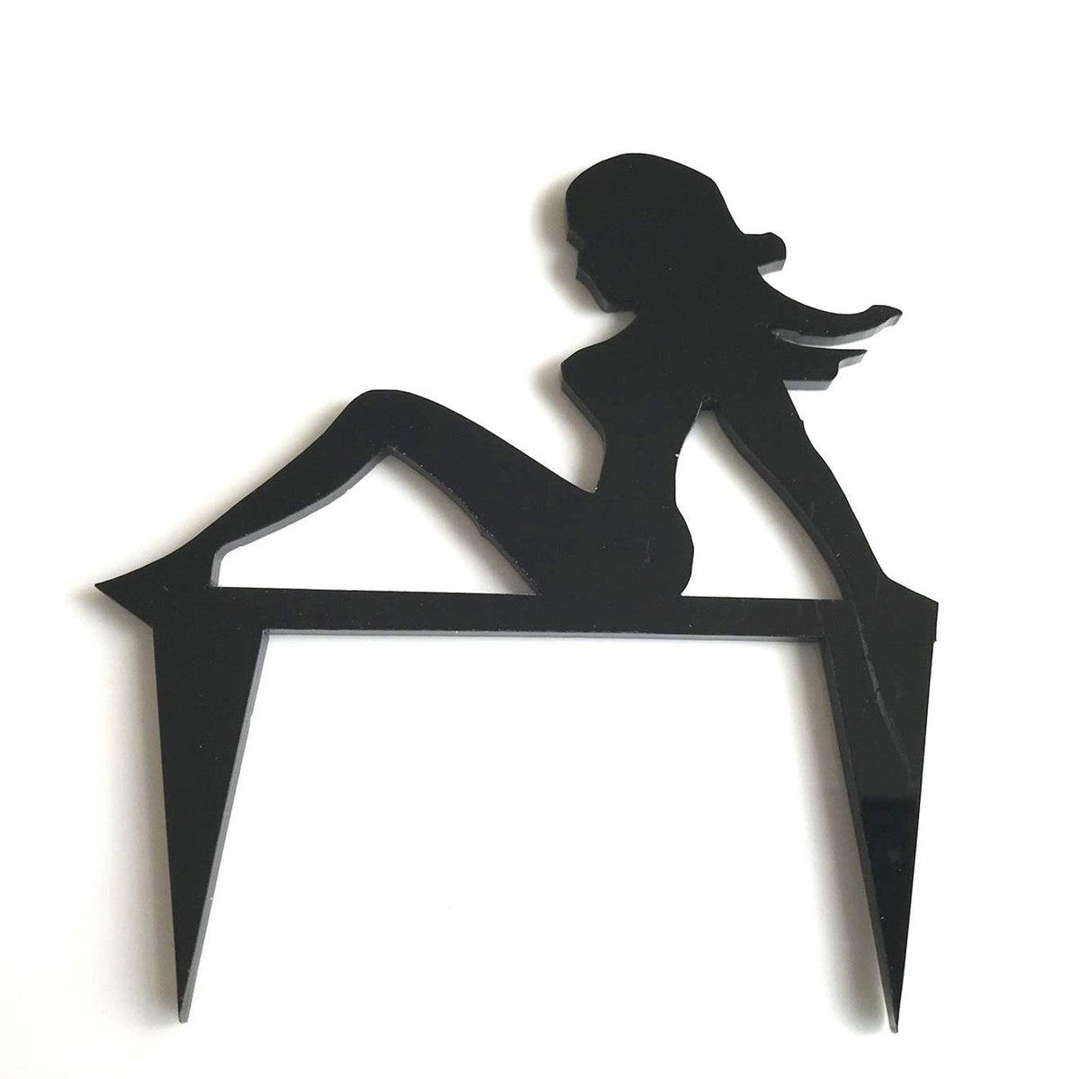 Black acrylic cake topper featuring the silhouette of a lounging lady, designed as a classic trucker mascot.
