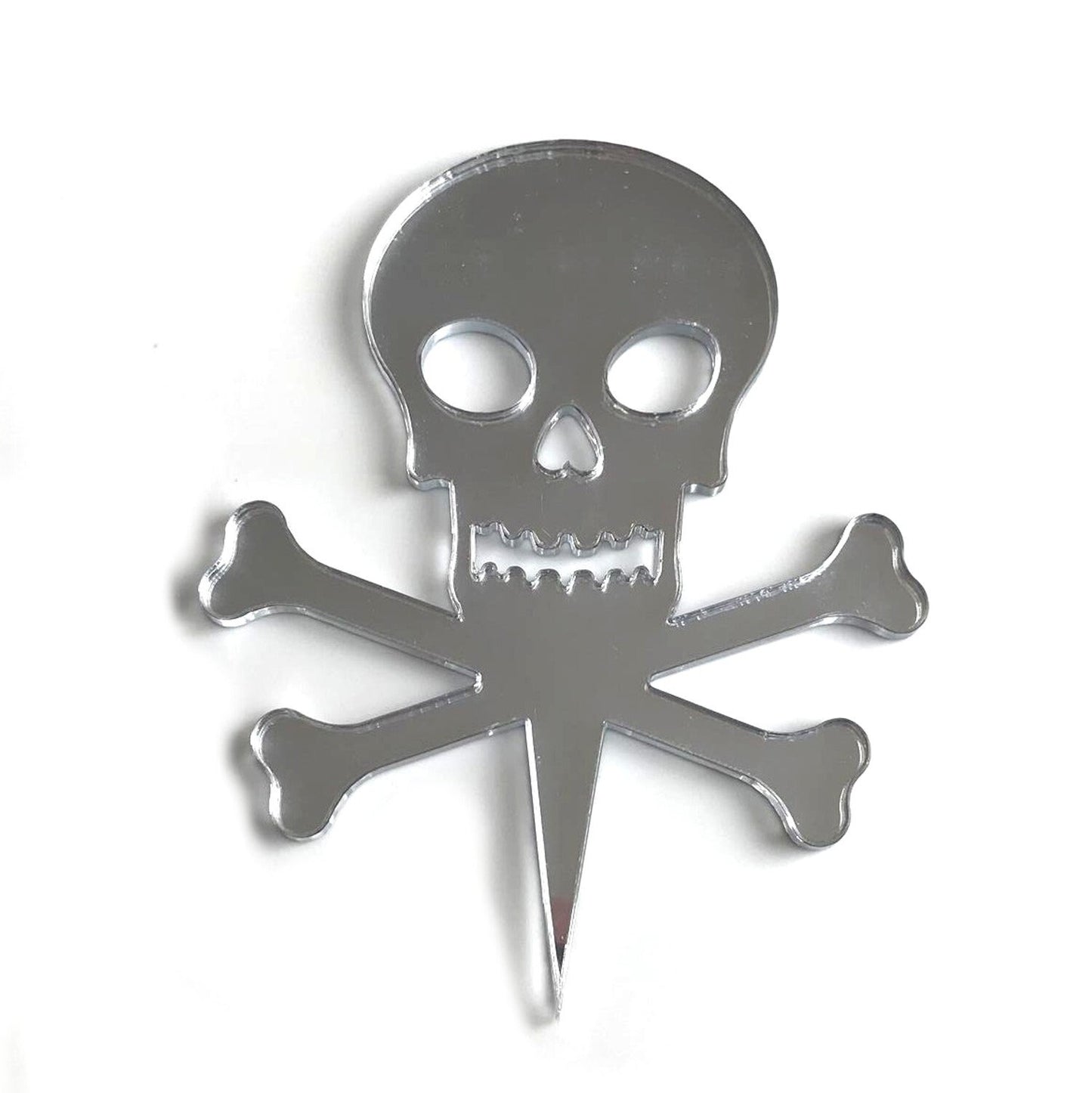 Silver mirror-finish recycled acrylic skull and crossbones cake topper on a white background.