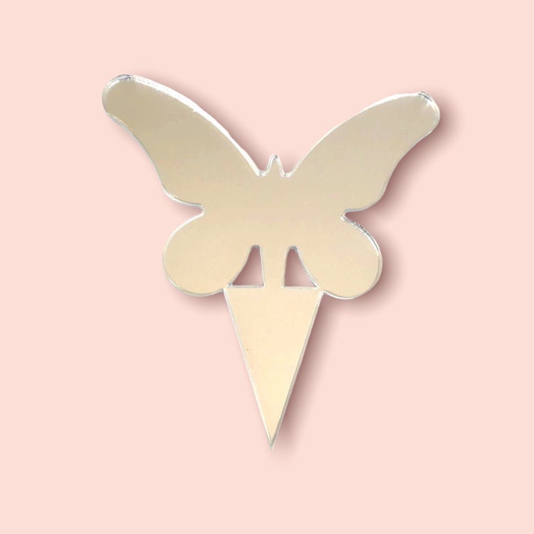 Reflective silver, mirror-finish butterfly cake topper with long wings and a pointed stake base.