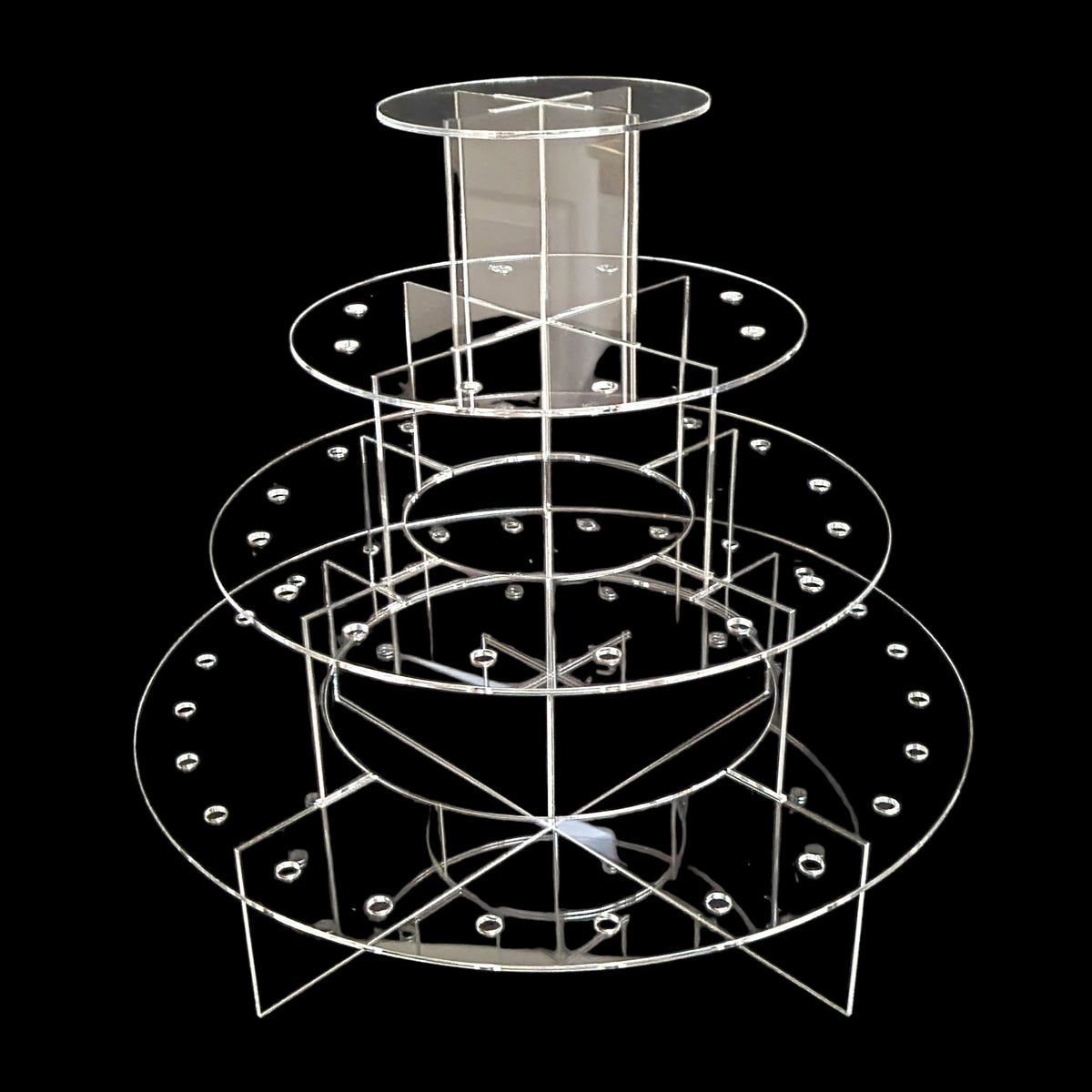 Clear 4-tier acrylic cake pop stand with circular platforms and support dividers, set against a black background.