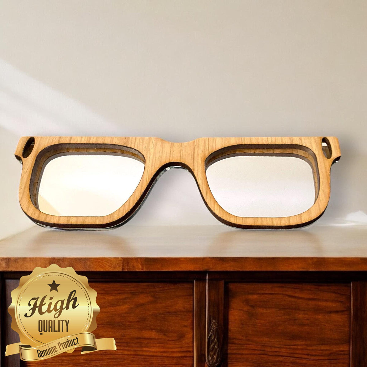 Retro, wood-framed glasses-shaped wall mirror with reflective lenses, resting on a wooden surface with a quality seal.