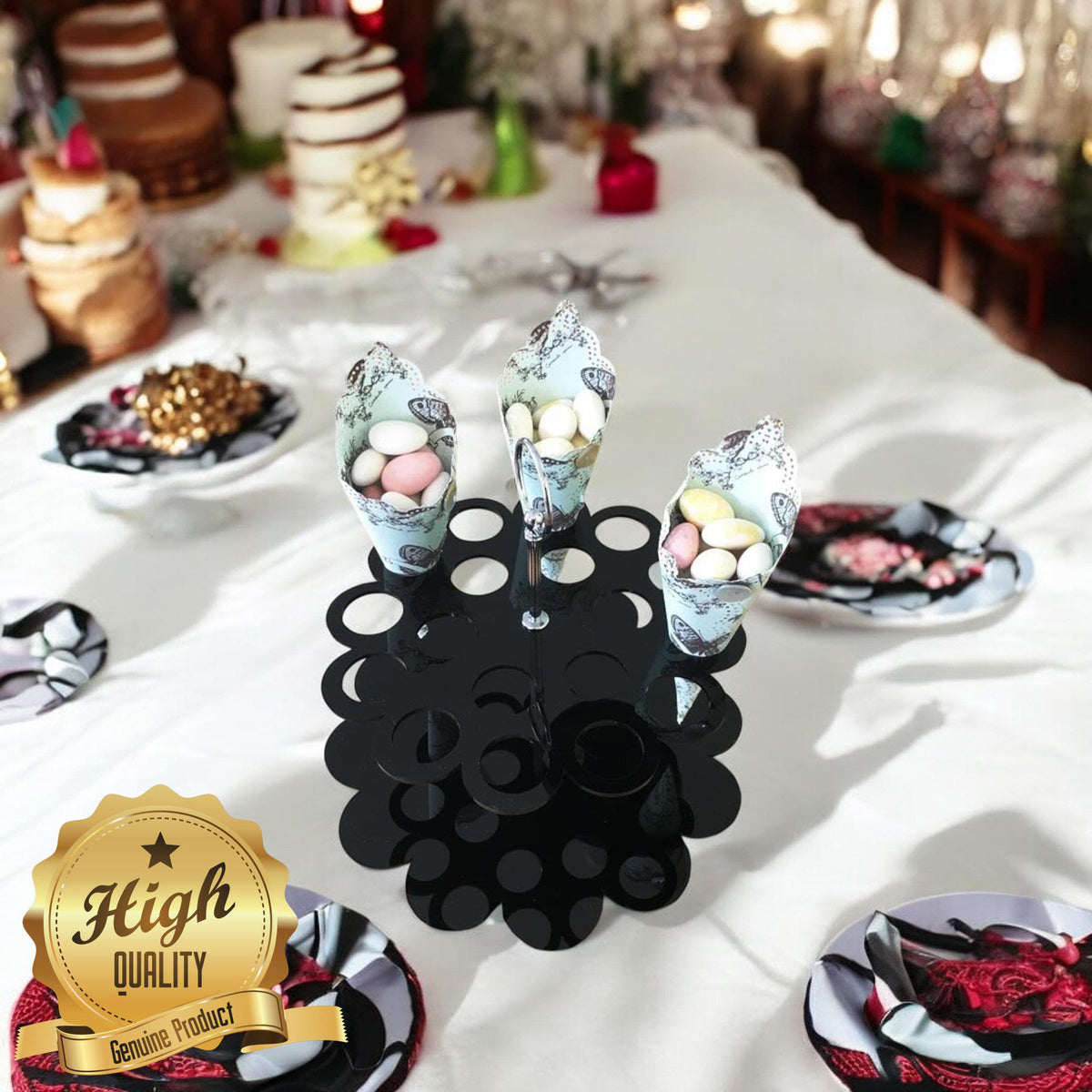 Black circular acrylic stand with multiple holes, holding three patterned paper cones filled with candy.