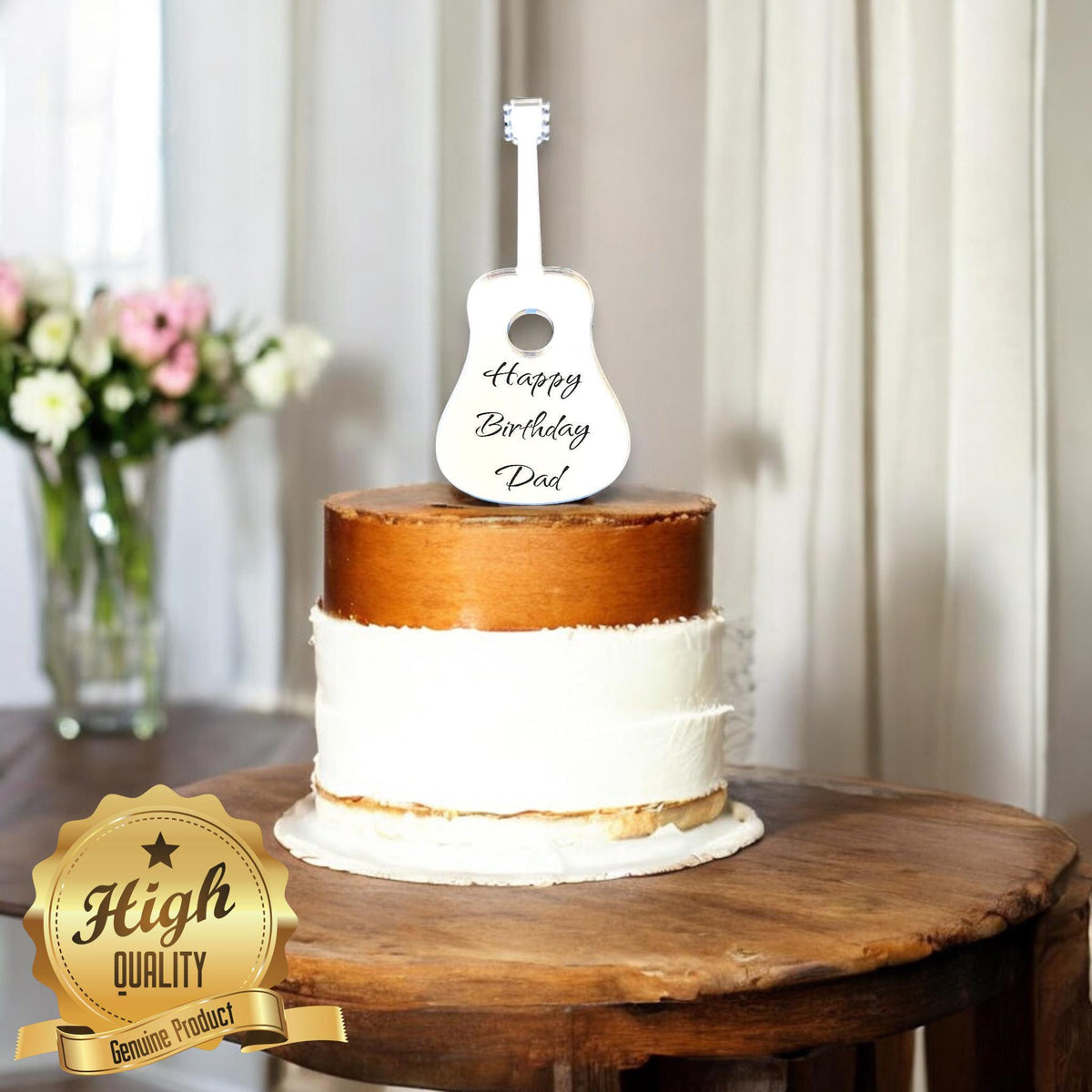 White acoustic guitar cake topper personalized with "Happy Birthday Dad" text atop a rustic two-tier cake.
