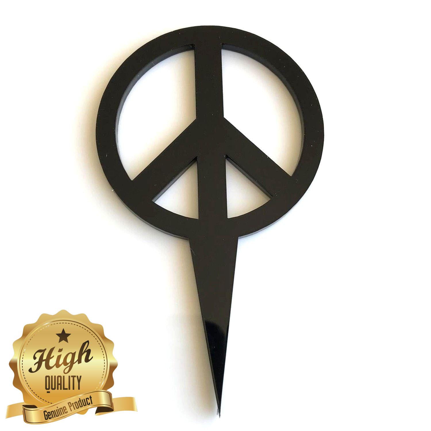 Glossy black recycled acrylic peace sign cake topper with a sharp pointed stake, set against a white background.