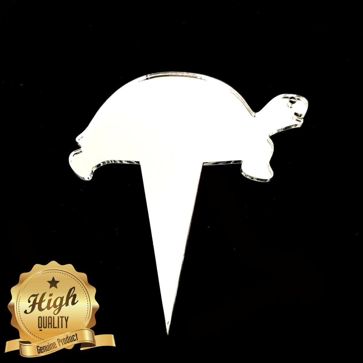 Glossy white acrylic turtle-shaped cupcake topper with a pointed stake base, shown against a solid black background.