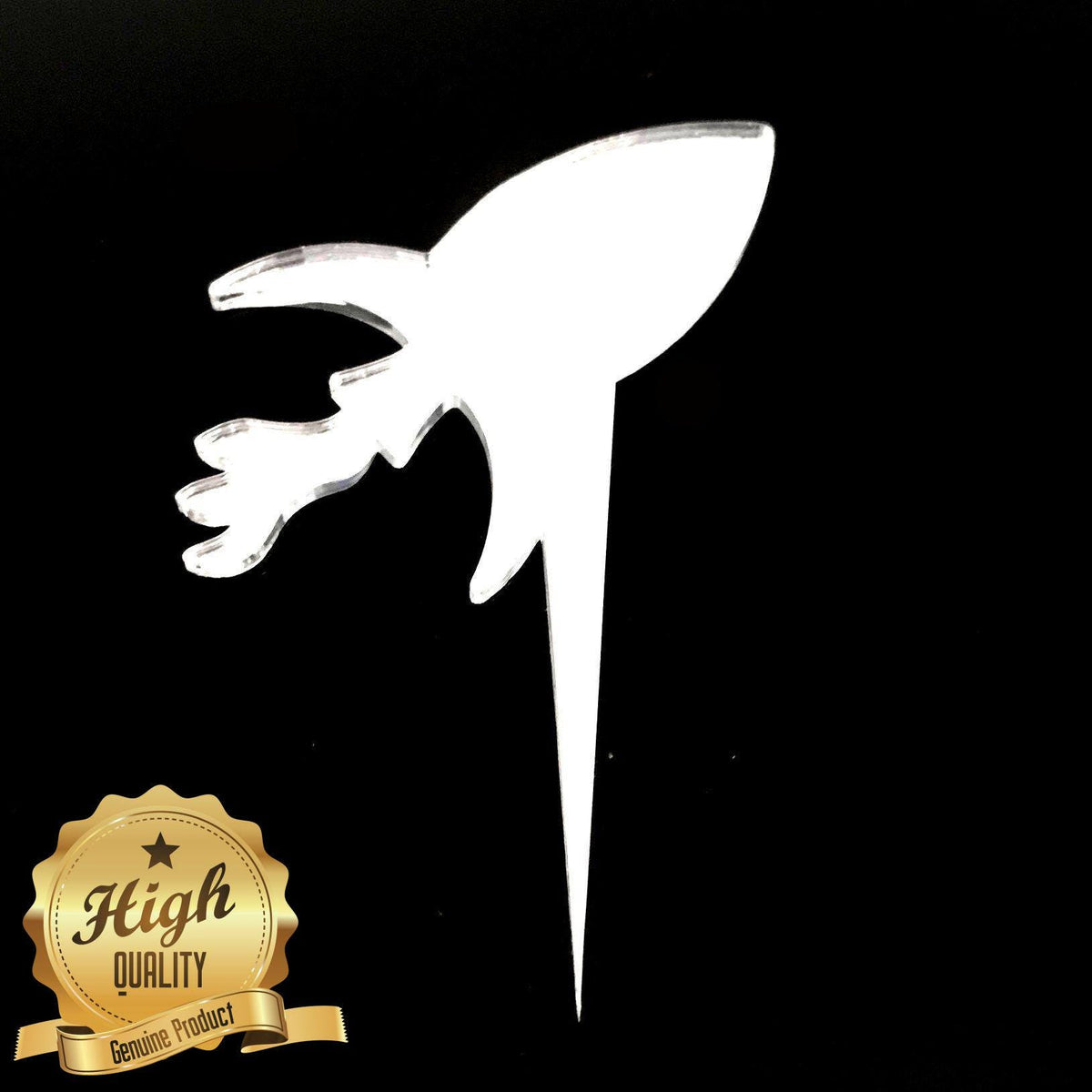 Clear acrylic rocket-shaped cake topper on a black background, with a gold "High Quality" badge in the corner.