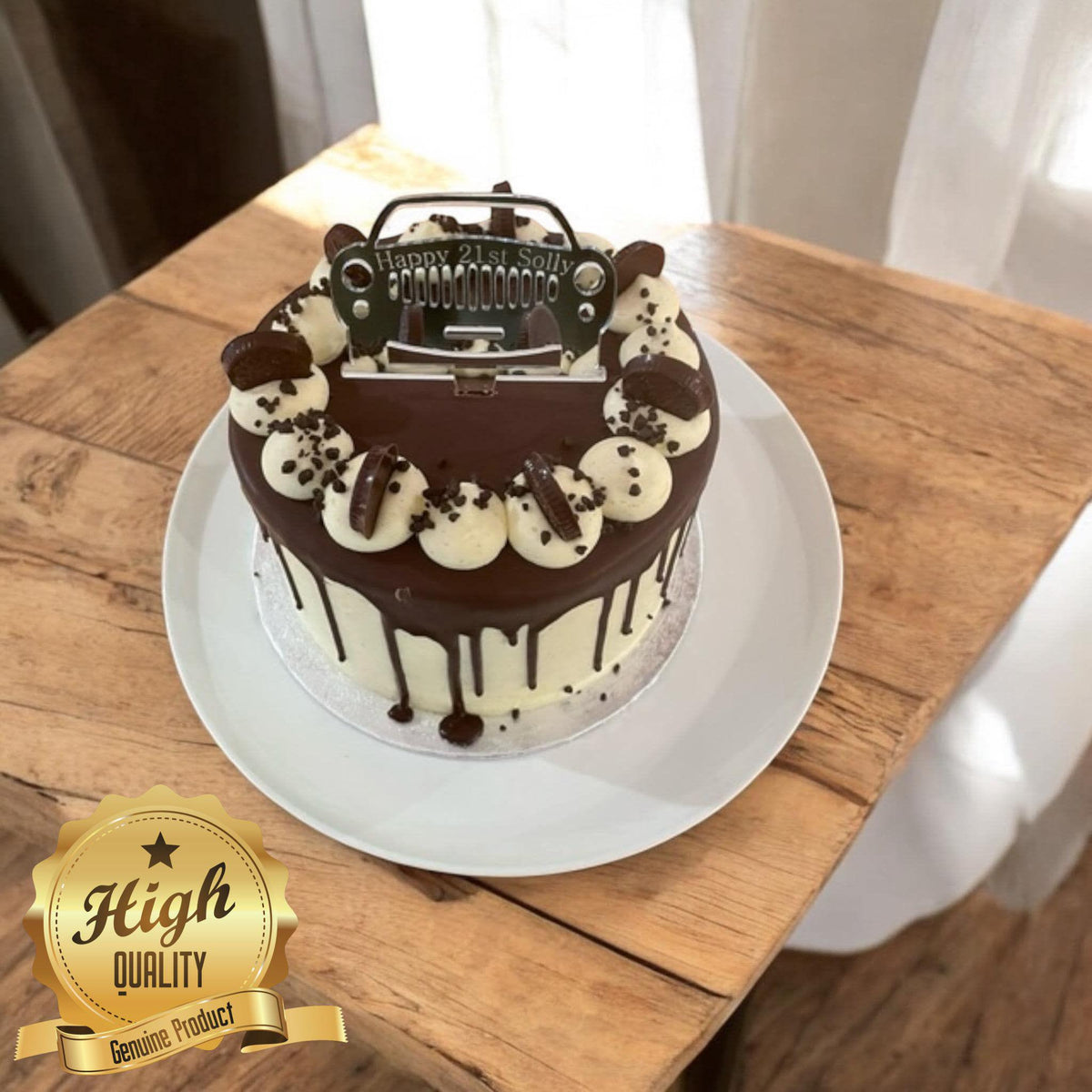 A custom silver, jeep-style acrylic cake topper engraved with "Happy 21st Solly" on a chocolate drip cake.