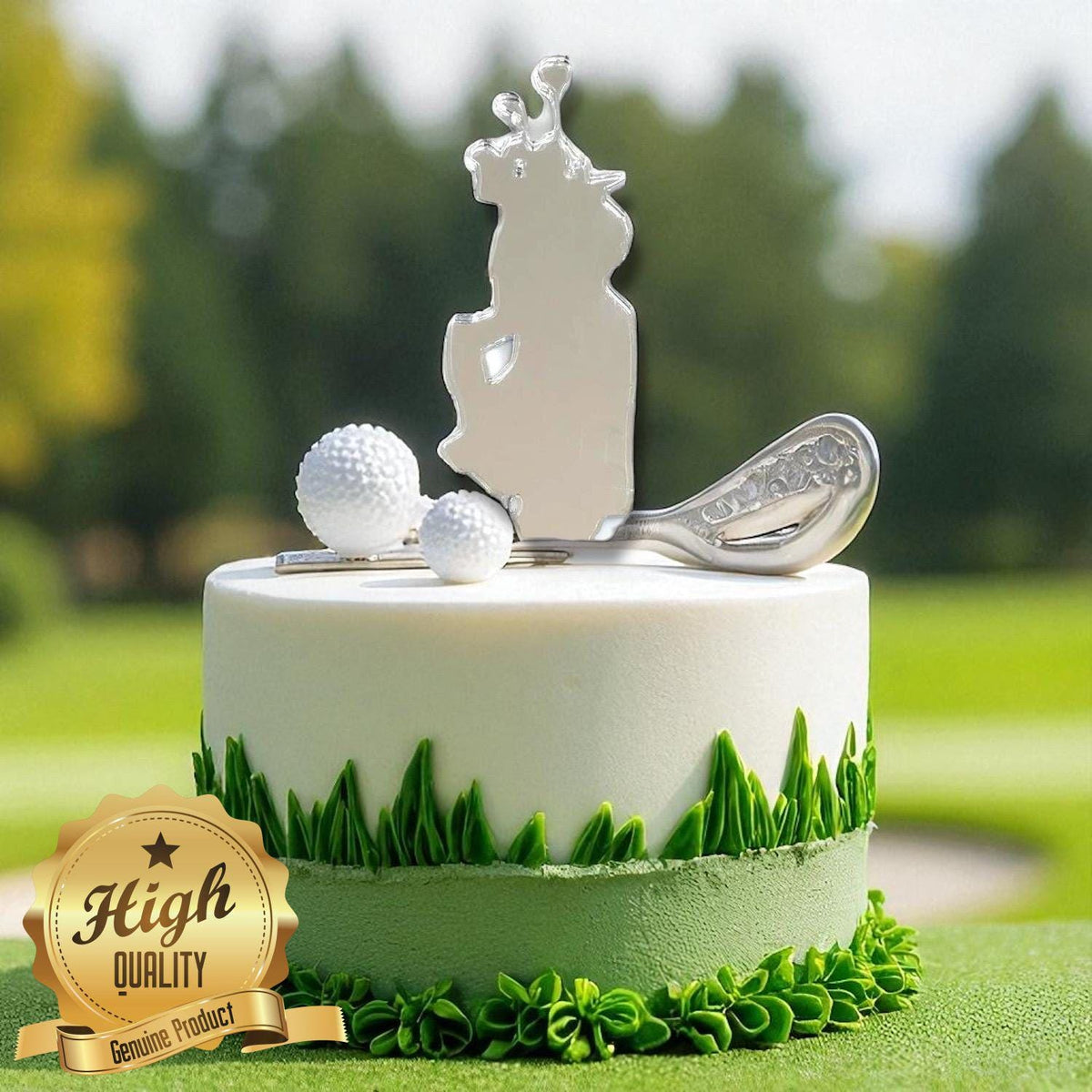 Silver recycled golf bag, ball, and club cake topper on a white cake decorated with green icing grass.