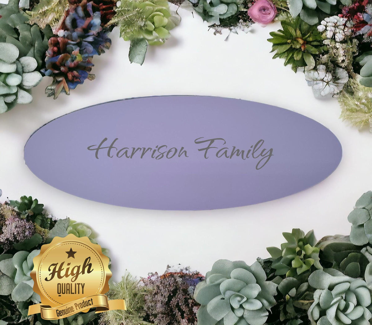Oval purple acrylic table runner engraved with "Harrison Family," surrounded by decorative faux succulents.