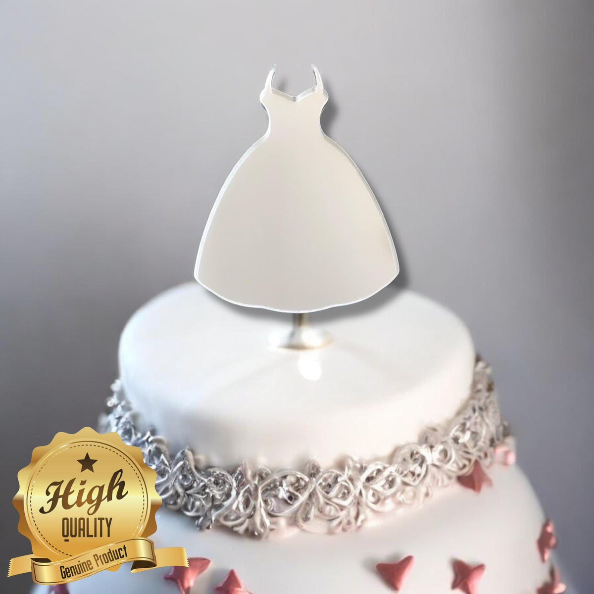 Silver mirror ball gown cake topper by SuperCoolCreations on a decorated white cake with pink hearts.
