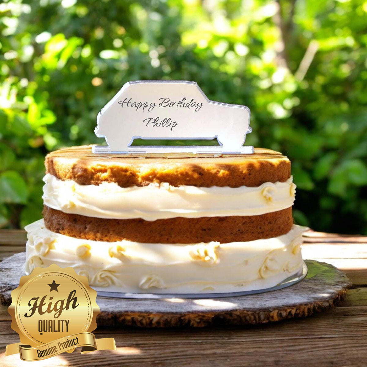 Mirror-finish hatchback car cake topper reading "Happy Birthday Phillip" atop a two-tier naked sponge cake.