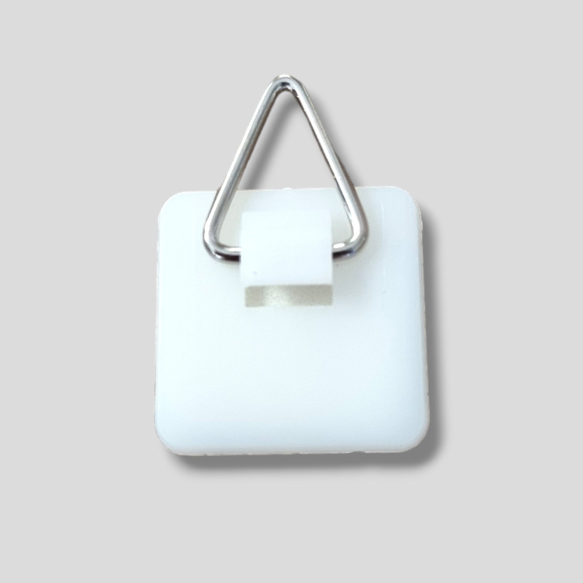 Silver triangle D-ring hanger attached to a square white plastic base.