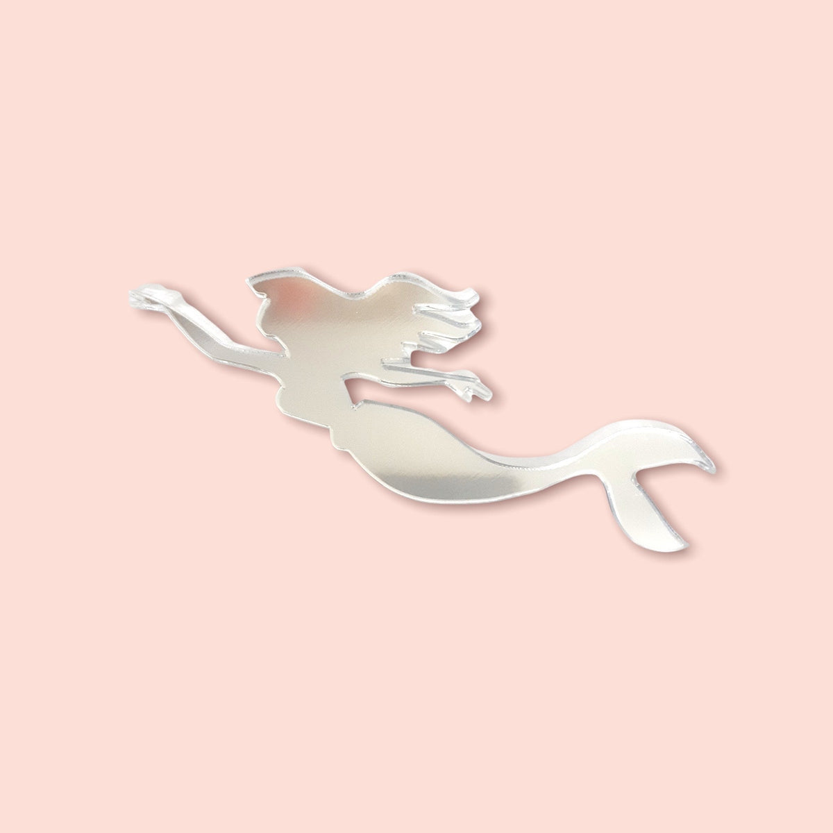 Silver mirrored acrylic wall accent shaped like a swimming mermaid with flowing hair and tail.