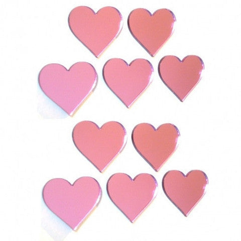 Ten pink heart-shaped mirrors arranged in a grid on a white background.
