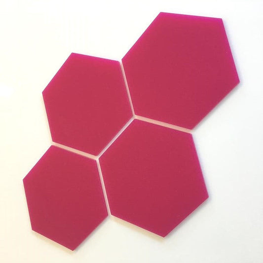 Four pink hexagon tiles arranged together on a white background.