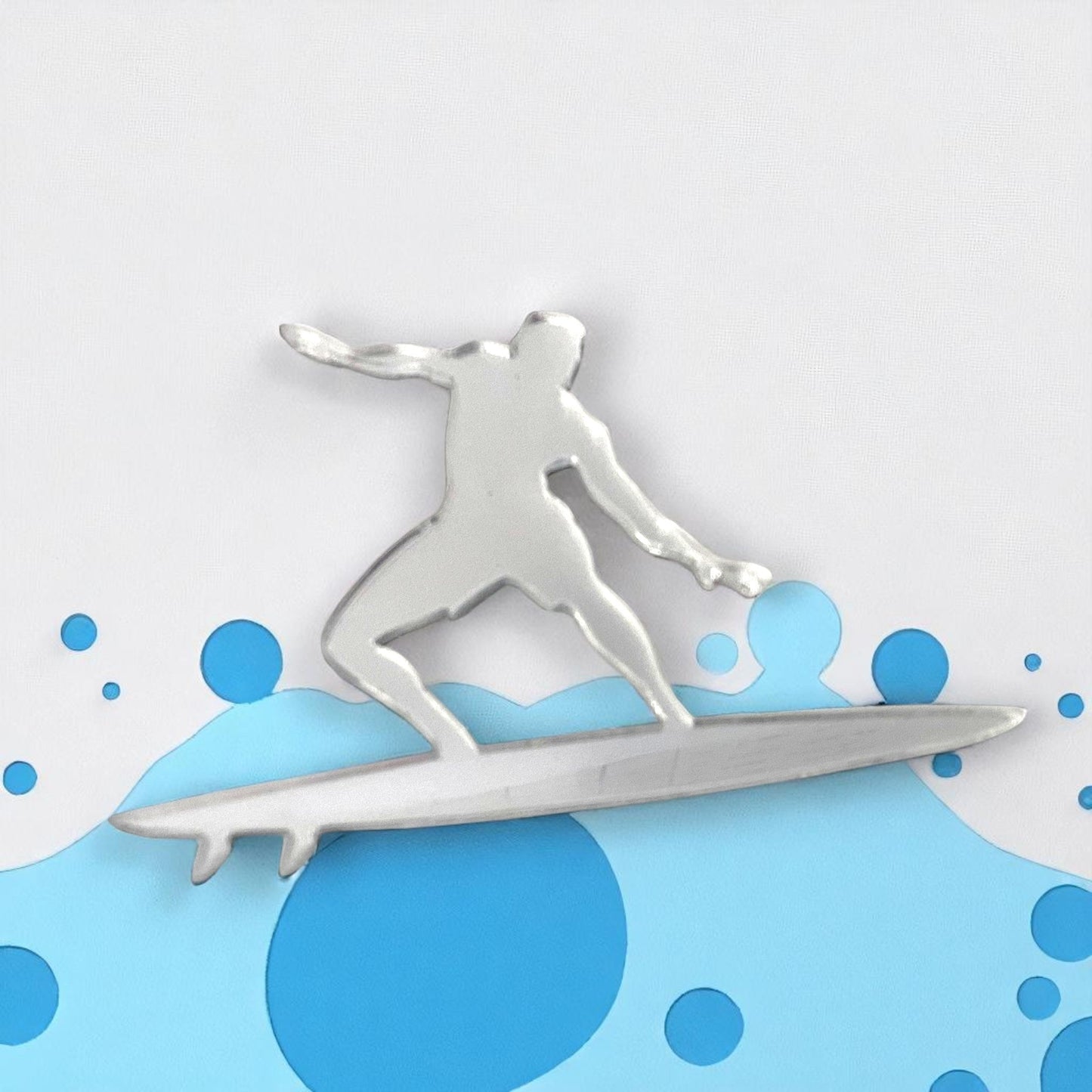 Silver surfer-shaped mirror mounted on a layered blue and white wave background.