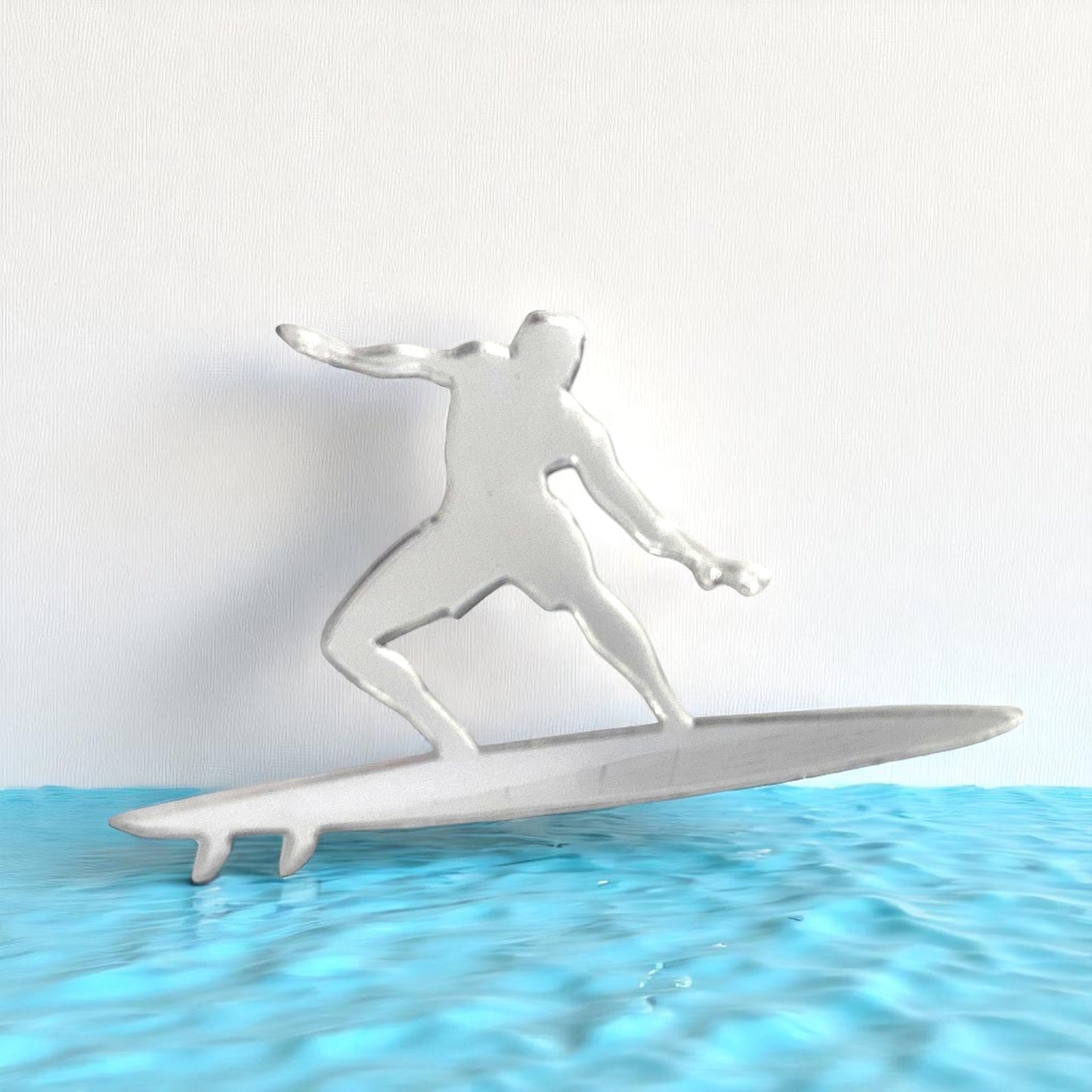 Surfer Mirror in the shape of a surfer riding a surfboard above blue water.