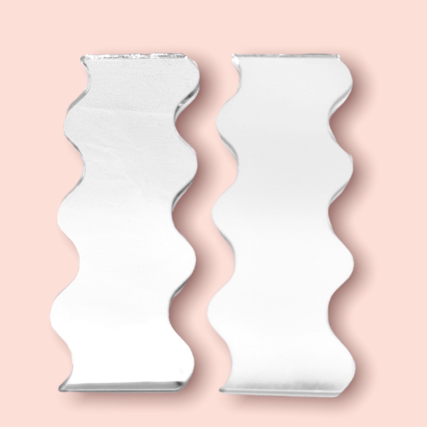 Pair of Wavy Shaped Mirrors with a White Backing & Hooks